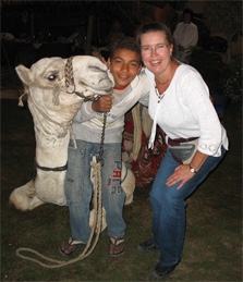 Claudia with Egyptian boy and his camel.
